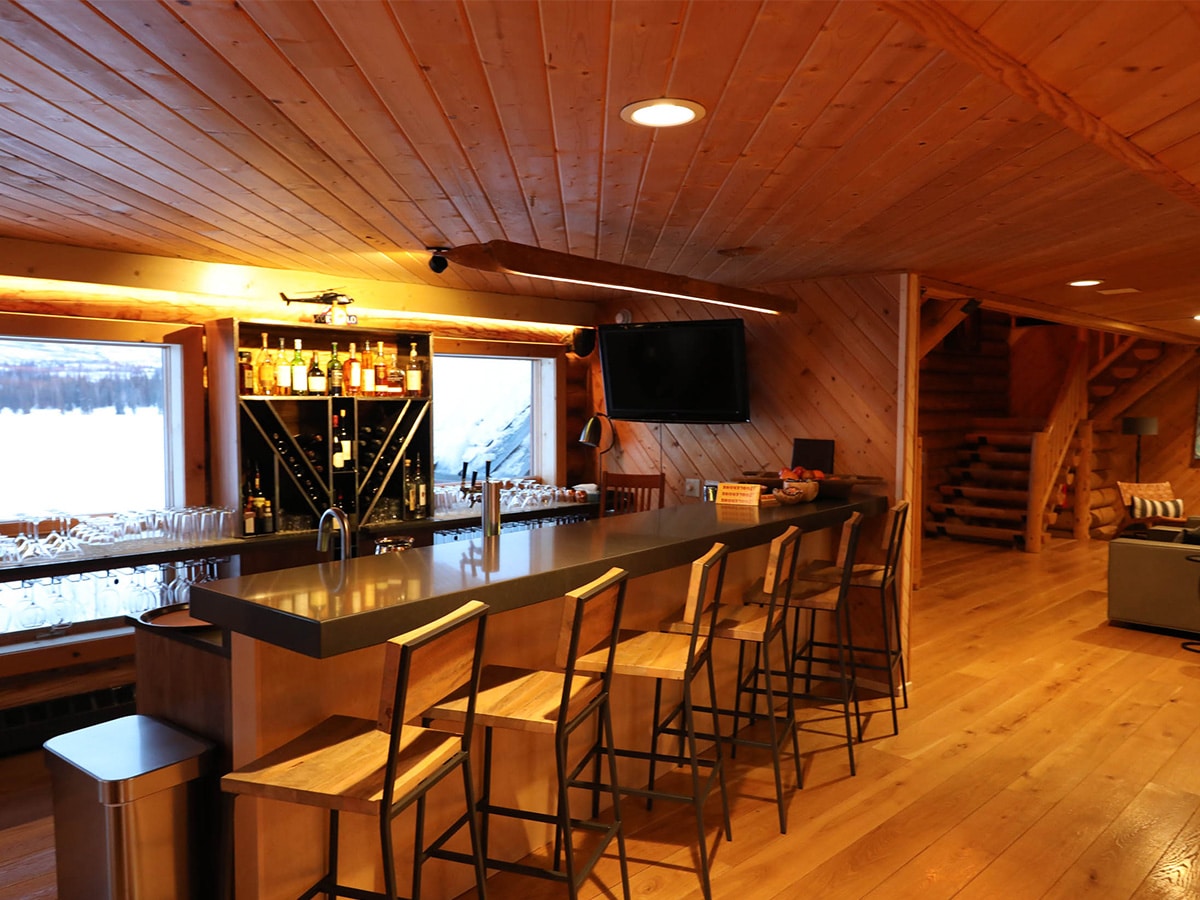 An inside view of the Tordrillo Mountain Lodge lakeside bar in Alaska.