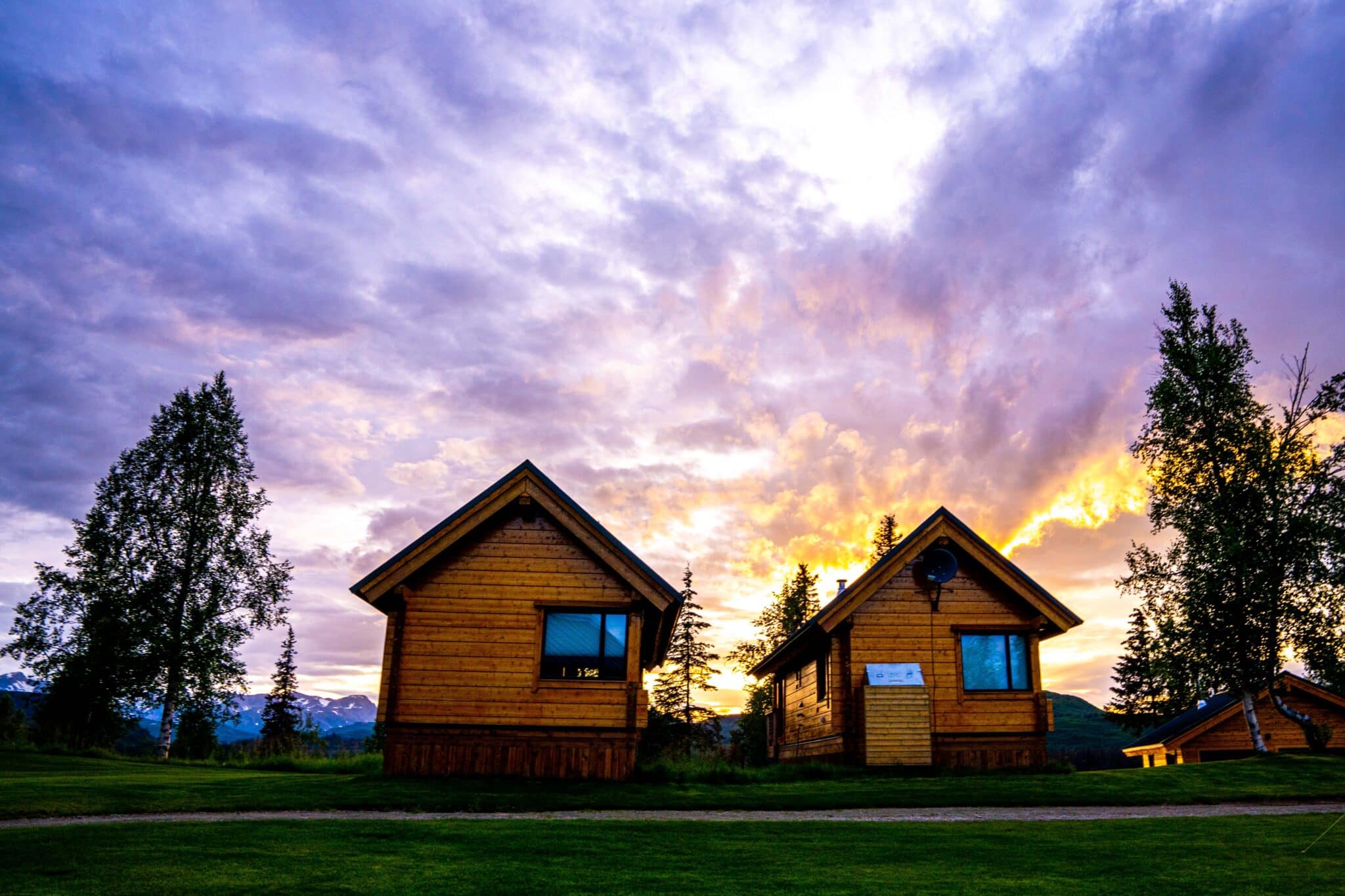 the private cabins at tordrillo mountain lodge under the sunset