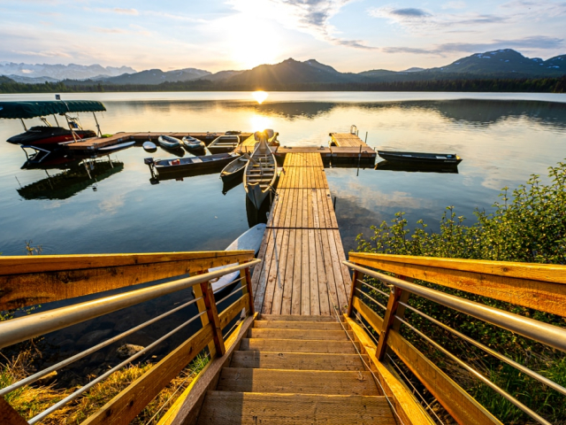 the dock at tordrillo mountain lodge filled with lake sports