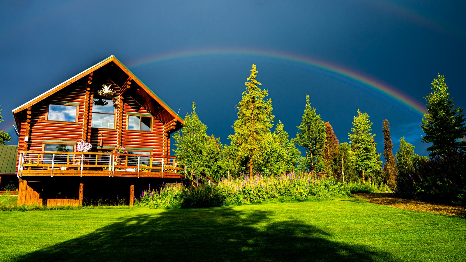 Tordrillo Mountain Lodge under a rainbow