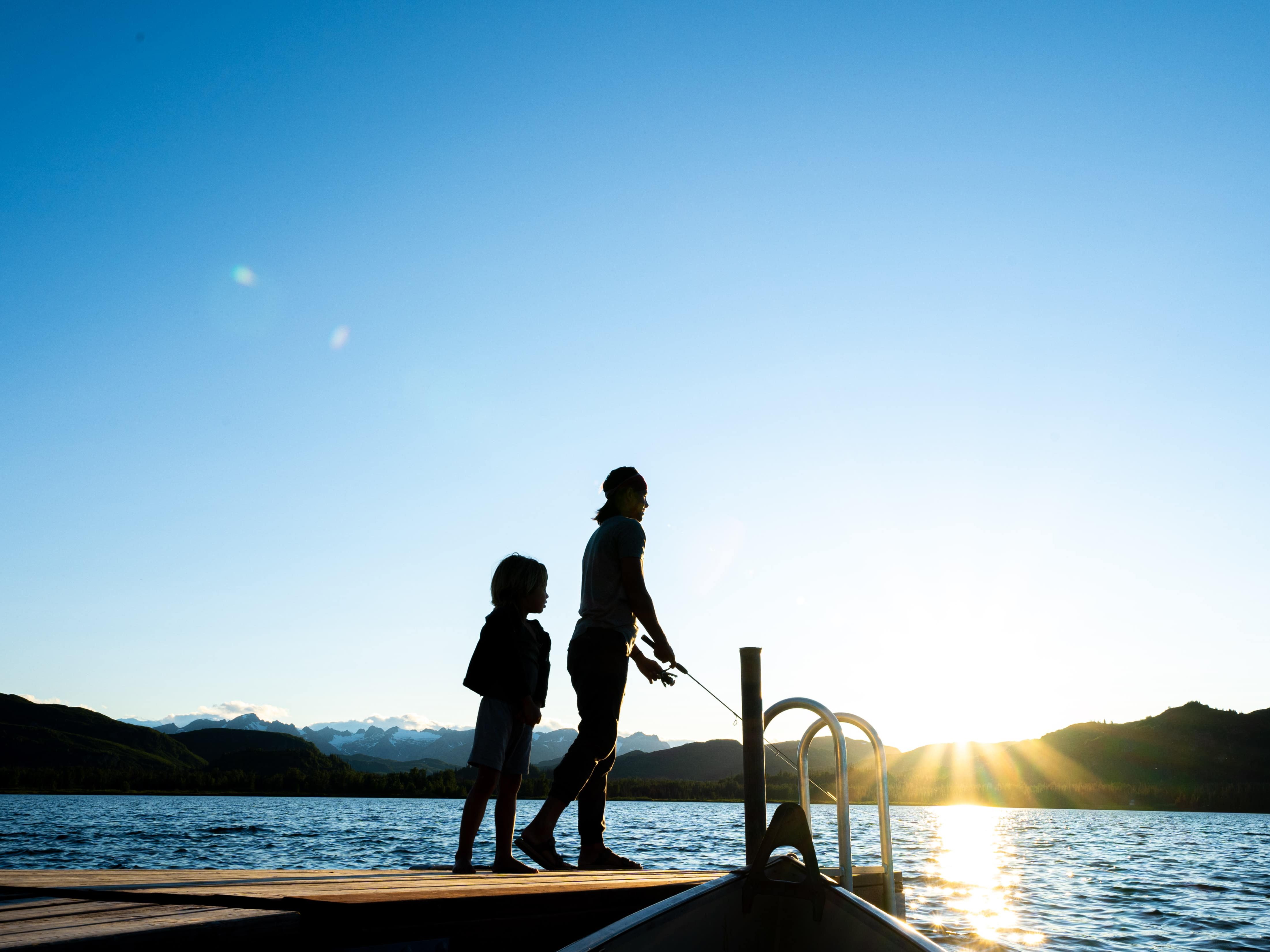 a father and son fish off the dock on Judd Lake