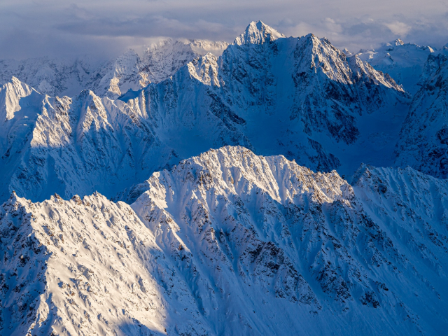 flying through the tordrillo mountains in the winter