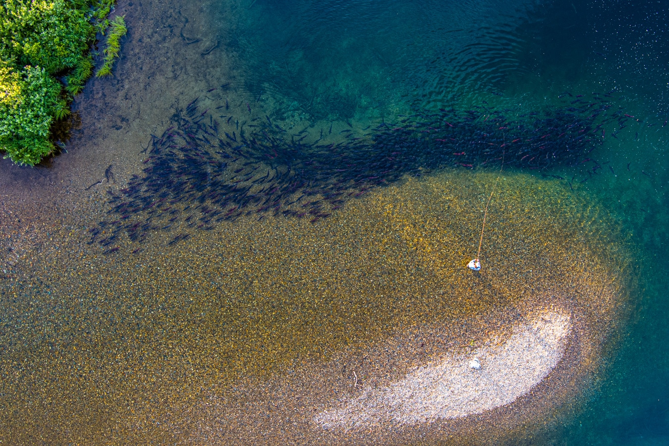 an shot of a man fishing on judd lake from above