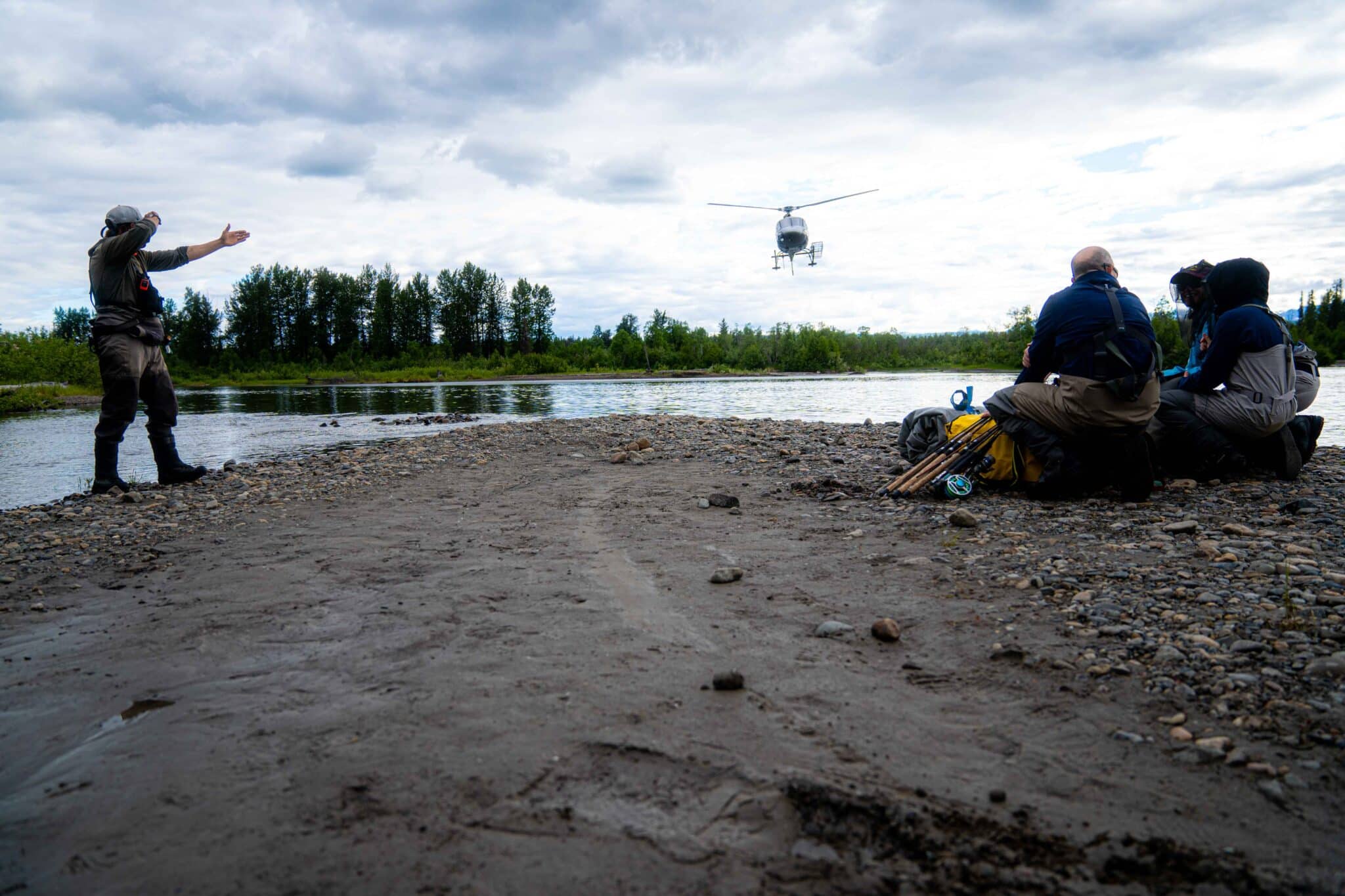 a helicopter comes to to pick up a group of fisherman