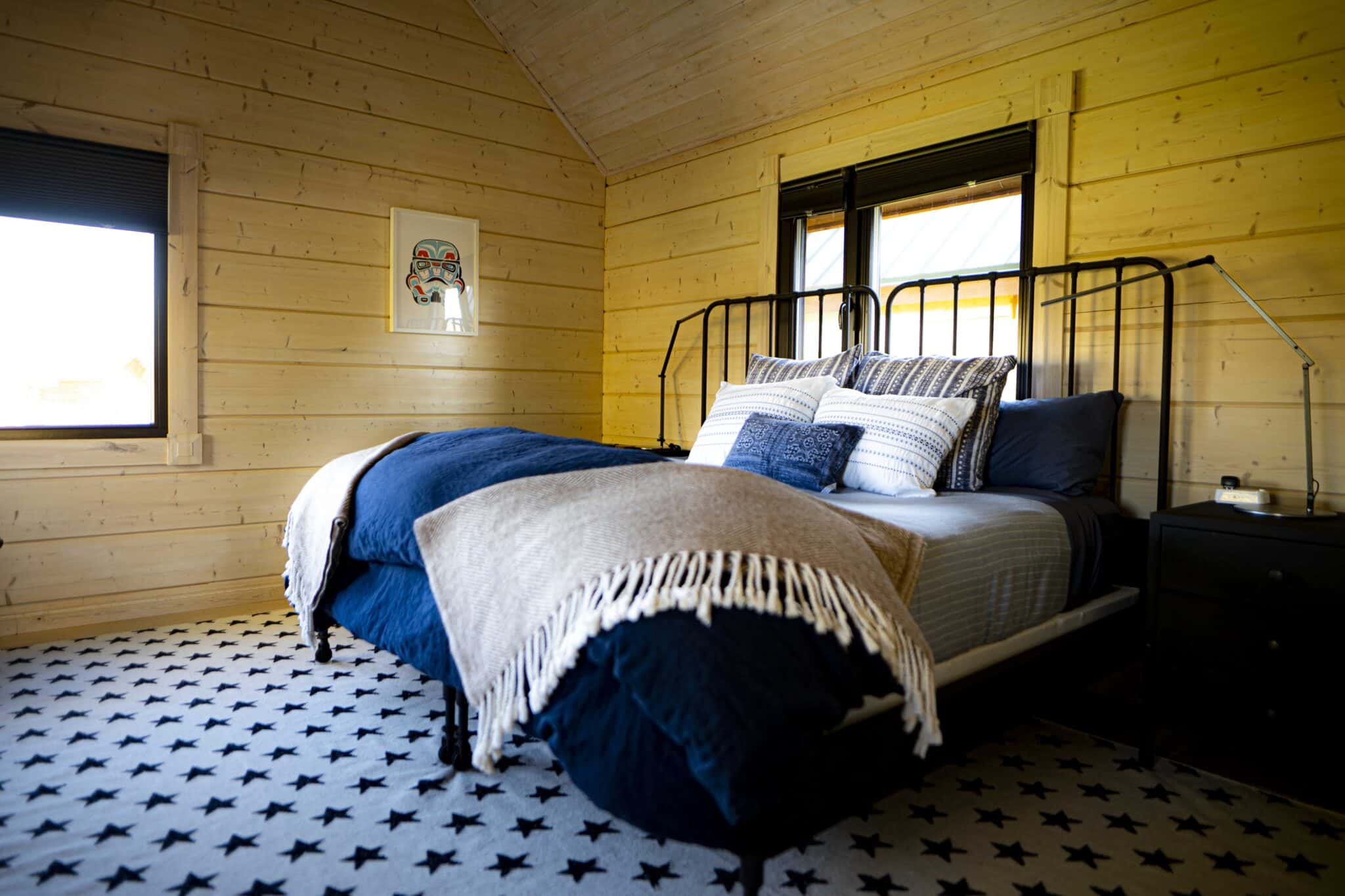 inside the bedroom of the canoe cabin at tordrillo mountain lodge