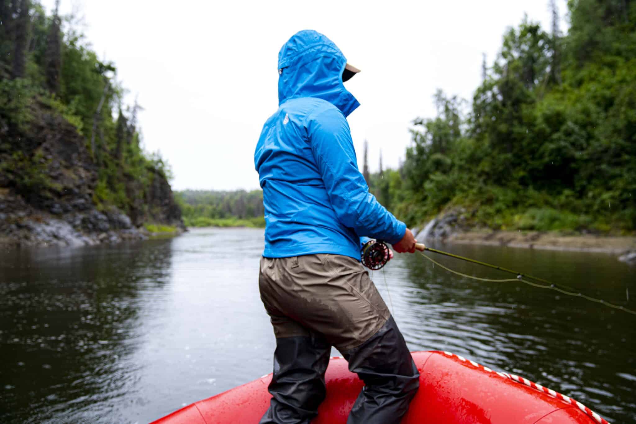 a person fishing out of the raft on the talchalitna river