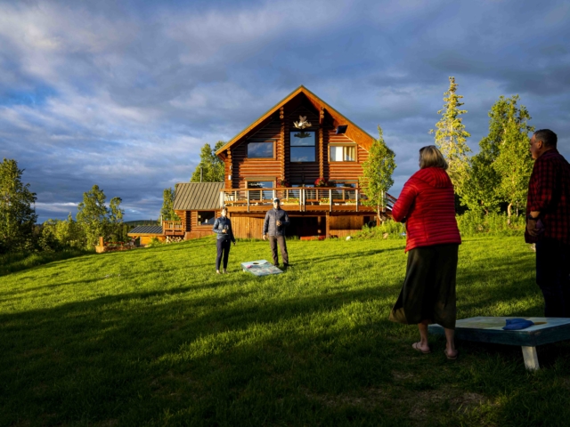 playing lawn games in front of the lodge