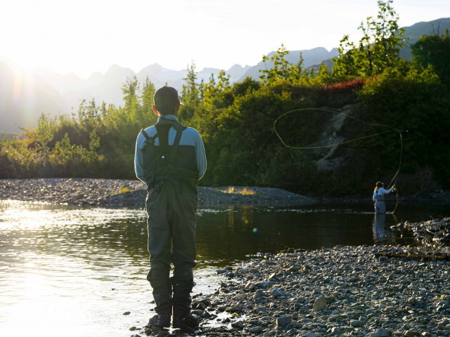 guide looking out as a client fishes on coal creek