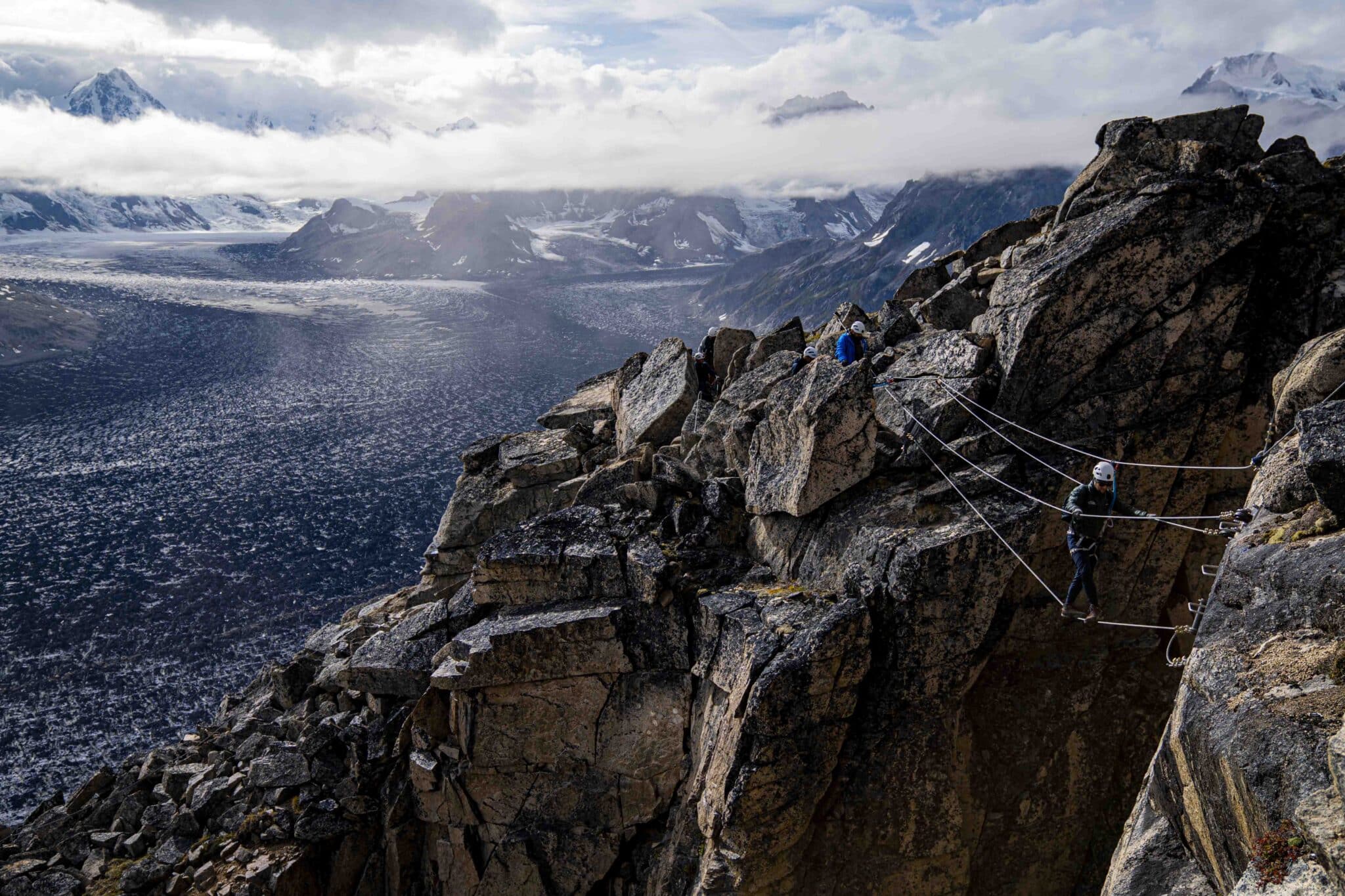 crossing the bridge of the via ferrata in the tordrillo mountains